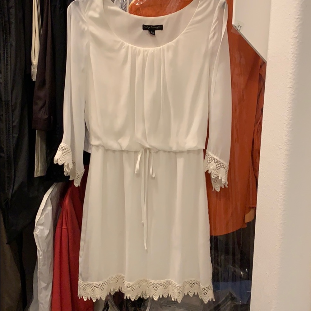 White dress with lace detailing cold shoulders